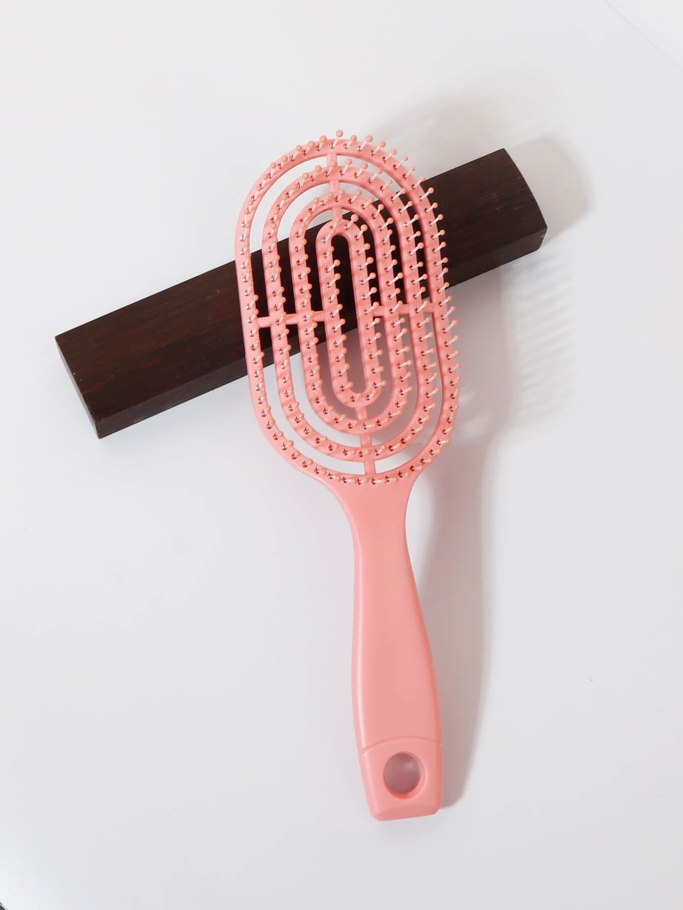 Ventilated oval paddle hair brush