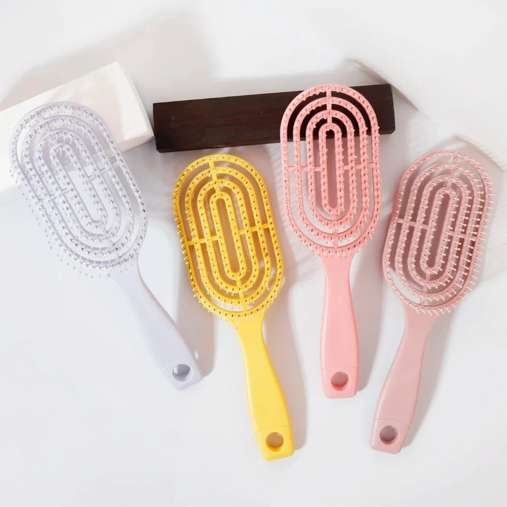 Ventilated oval paddle hair brush