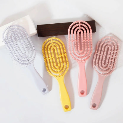 Ventilated oval paddle hair brush