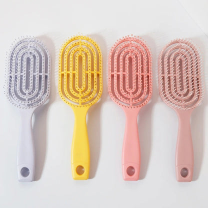 Ventilated oval paddle hair brush