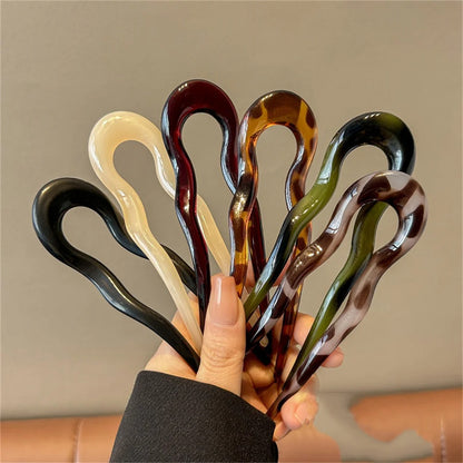 Curved hair bun pin