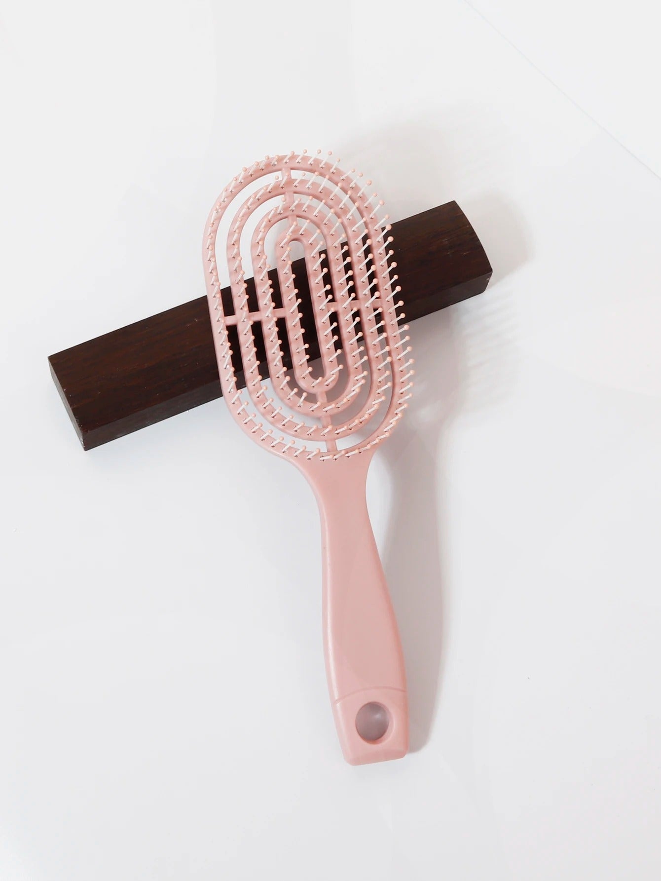 Ventilated oval paddle hair brush