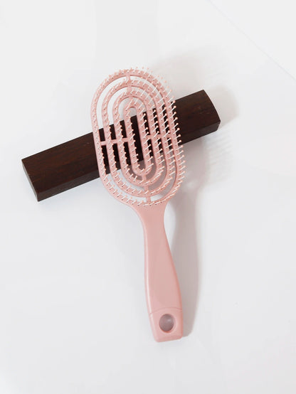 Ventilated oval paddle hair brush